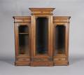 A Renaissance Revival Walnut and Birdseye Maple Bookcase