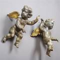 A Pair of Baroque Style Painted and ParcelGilt Cherubs