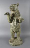 A Painted Cast Metal Figure of a Bear