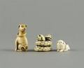 A Group of Three Japanese Ivory Netsuke of Dogs