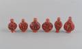A Group of Six Cinnabar Lacquer Style Snuff Bottles
