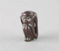 A Carved Wood Netsuke