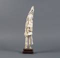 A Carved Ivory Figure of a Man