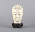 A Chinese Carved Ivory Head