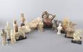A Collection of Fifteen Terra Cotta Figures
