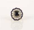 A 14 Karat Yellow Gold Purple Spinel and Diamond Ring
