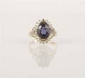 An 18 Karat Yellow Gold Diamond and Iolite Ring
