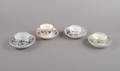 A Group of Four Cups and Saucers