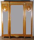 A Louis XVI Style Gilt Metal Mounted Armoire