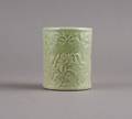 A Chinese Celadon Glazed Molded Porcelain Brushpot