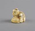 A Carved Ivory Netsuke of a Crouching Man