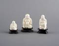 A Group of Three Carved Ivory Figures of Buddha