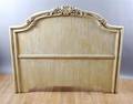 A Carved and Painted Hardwood Headboard