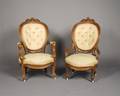 A Pair of Walnut Armchairs
