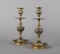 A Pair of Brass Candlesticks probably Indian