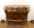 A Louis XV Style Walnut and Parcel Bombe Gilt Commode