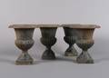 A Set of Four Cast Iron Urns
