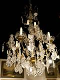 A GiltMetal and Glass EightLight Chandelier