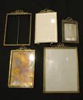 A Collection of Five Gilt Metal Frames