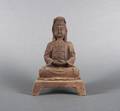 A Chinese Cast Iron Figure of a Seated Guanyin
