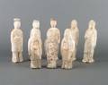 A Group of Eight Chinese Painted Pottery Figures of Attendants