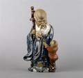 A Chinese Mud Figure of Shou Lao