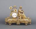 A Gilt Metal Figural Mantle Clock