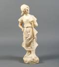 An Alabaster Figure of a Striding Female