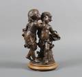 A Patinated Cast Metal Figural Group of Two Children Whispering after Auguste Moreau