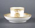 A Sevres Style Gilt Decorated Teacup and Saucer