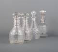 A Collection of Four Cut Glass Decanters
