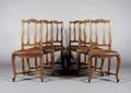 A Set of Six Leather Upholstered Side Chairs