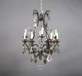 An Iron and Crystal TwelveLight Chandelier