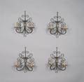 A Set of Four Iron and Gilt Metal TwoLight Sconces