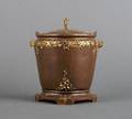 A French Gilt and Patinated Bronze Barrel Form Box