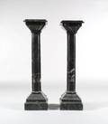 A Pair of Continental Black Marble Pedestals