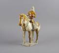 A Chinese Sancai Glazed Pottery Figure of a Horse and Rider