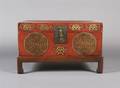 A Chinese Red Leather Trunk on Stand