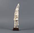 A Carved Ivory Figure of a Man