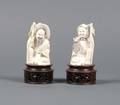 A Pair of Chinese Carved Ivory Figures of a Fisherman and Fisherwoman