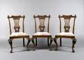 A Set of Three Carved Walnut Side Chairs
