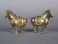A Pair of Chinese Bronze and Parcel Gilt Horses