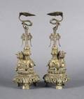 A Pair of Chinese Bronze and Parcel Gilt Candle Holders