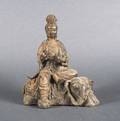 A Chinese Cast Metal Figure of Guanyin Seated on an Elephant