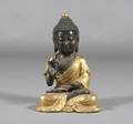 A Chinese Gilt Bronze Figure of a Seated Buddha