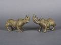A Pair of Chinese Bronze Figures of Rhinoceroses