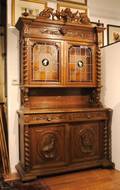 A Carved Oak Hunt Cabinet