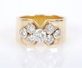 A 14 Karat Yellow Gold and Diamond Ring