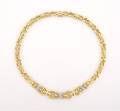 An 18 Karat Yellow White Gold and Diamond Necklace