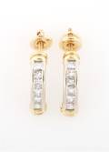 A Pair of 14 Karat White and Yellow Gold and Diamond Earrings